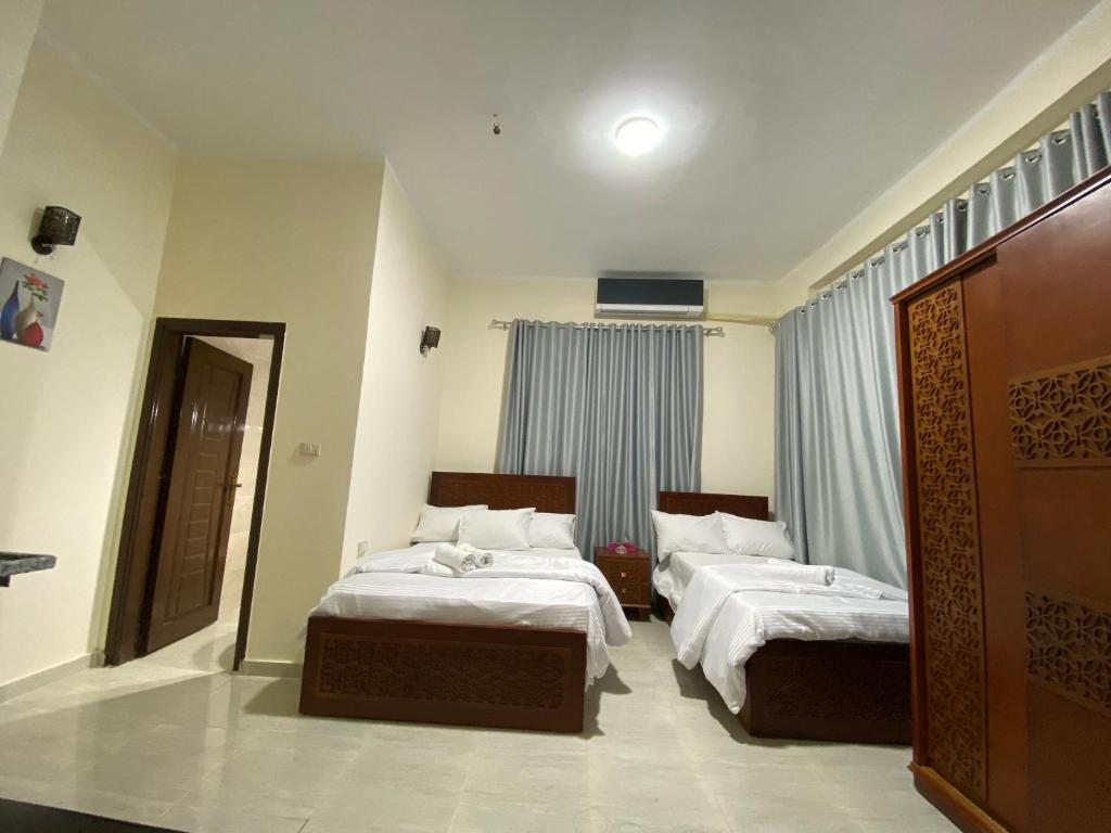 Postel nebo postele na pokoji v ubytování Sneferu Hotel