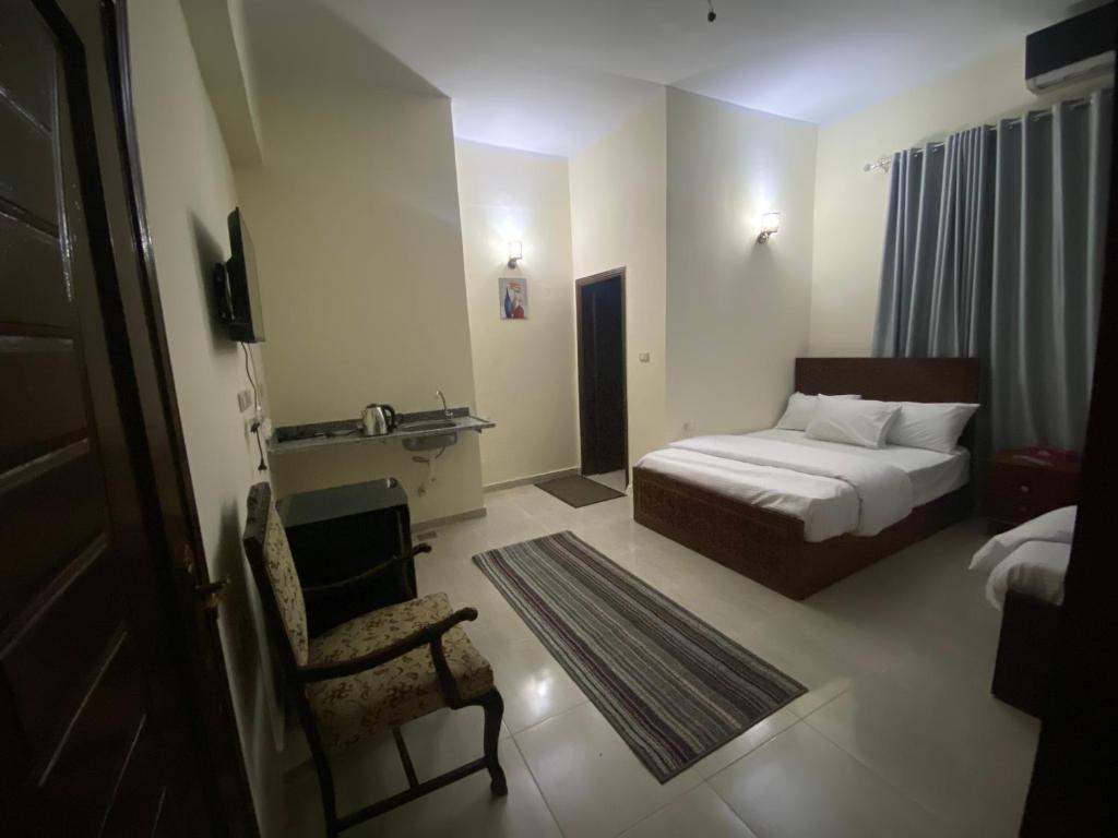 Postel nebo postele na pokoji v ubytování Sneferu Hotel