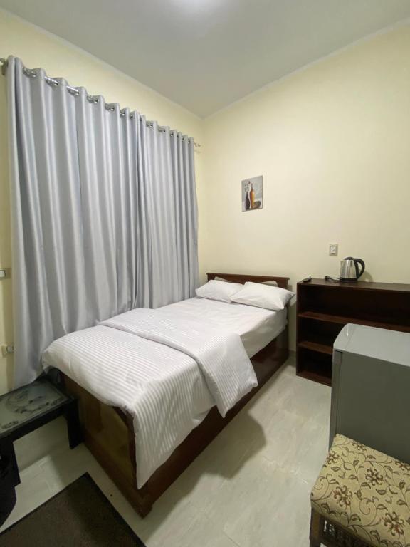 Postel nebo postele na pokoji v ubytování Sneferu Hotel