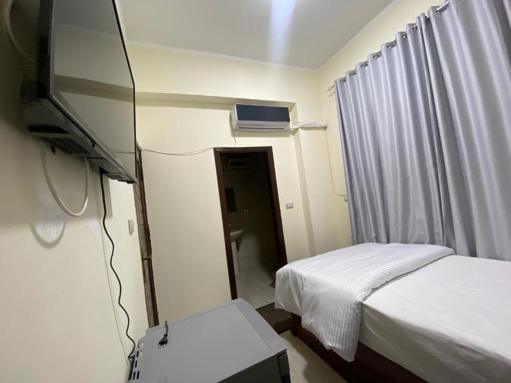 TV a/nebo společenská místnost v ubytování Sneferu Hotel
