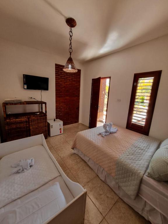 Postel nebo postele na pokoji v ubytování Aloha Beach Guest House