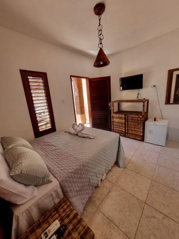 Postel nebo postele na pokoji v ubytování Aloha Beach Guest House
