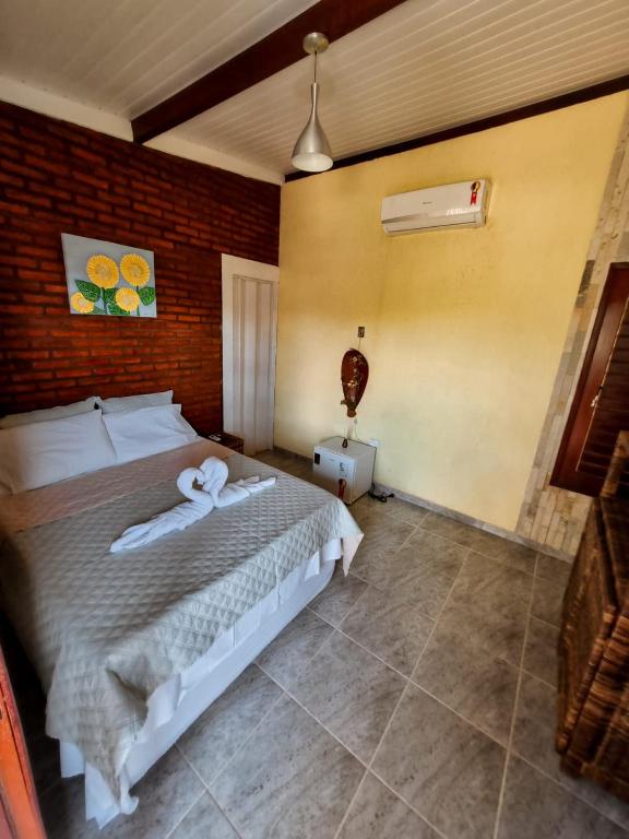 Postel nebo postele na pokoji v ubytování Aloha Beach Guest House