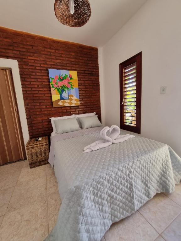Postel nebo postele na pokoji v ubytování Aloha Beach Guest House