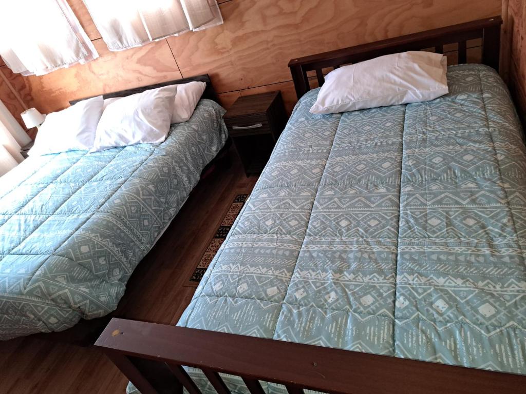 Postel nebo postele na pokoji v ubytování Cabañas Tripanko Chiloe