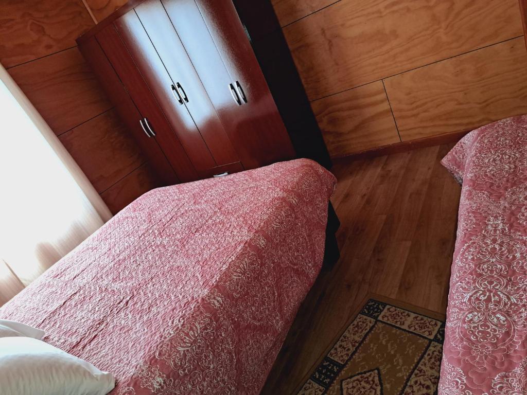 Postel nebo postele na pokoji v ubytování Cabañas Tripanko Chiloe