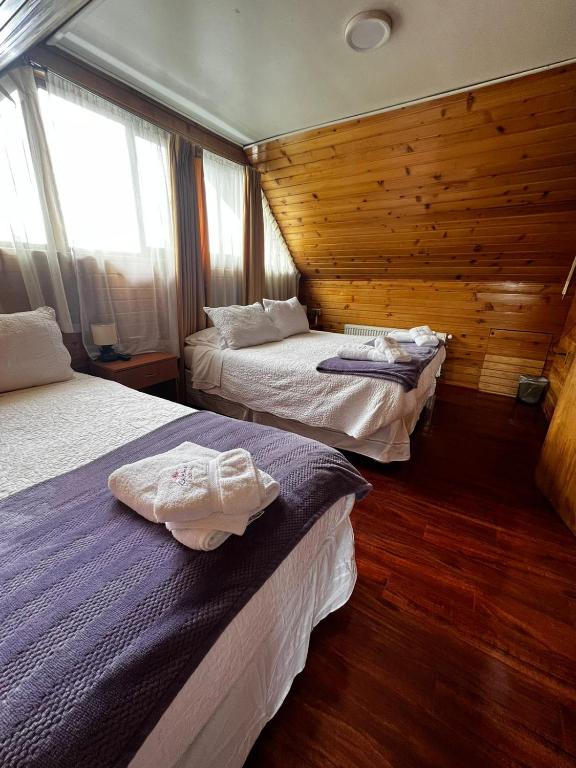 Postel nebo postele na pokoji v ubytování Hostal Katemu