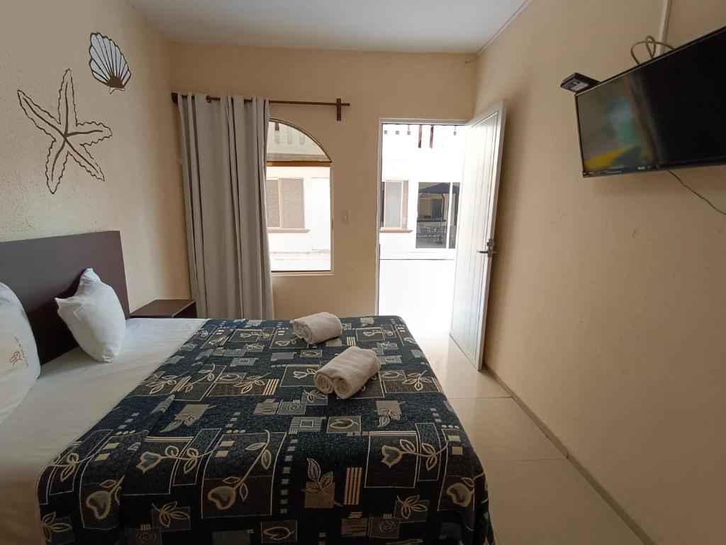 Postel nebo postele na pokoji v ubytování Hotel Playa de Oro - Enfrente de WTC y Plazas Comerciales