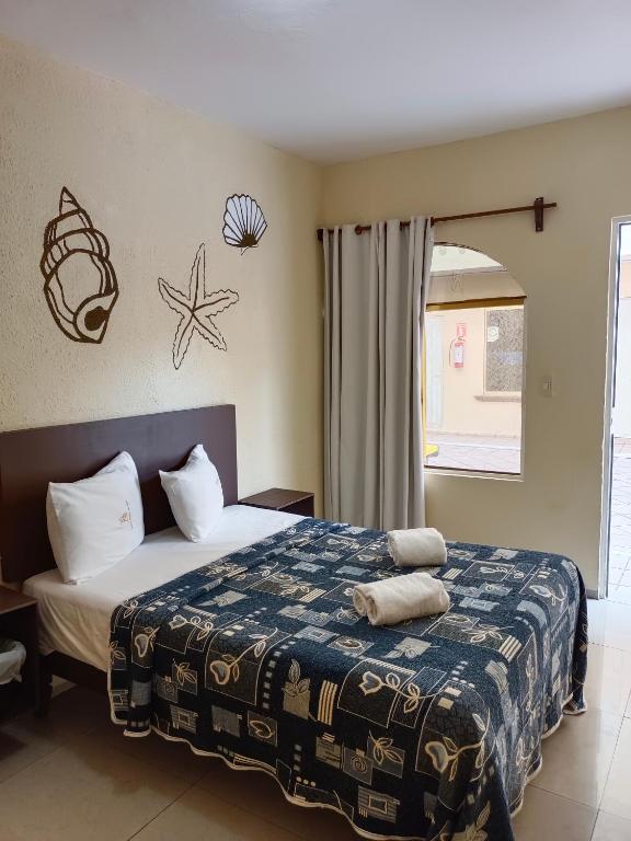 Postel nebo postele na pokoji v ubytování Hotel Playa de Oro - Enfrente de WTC y Plazas Comerciales