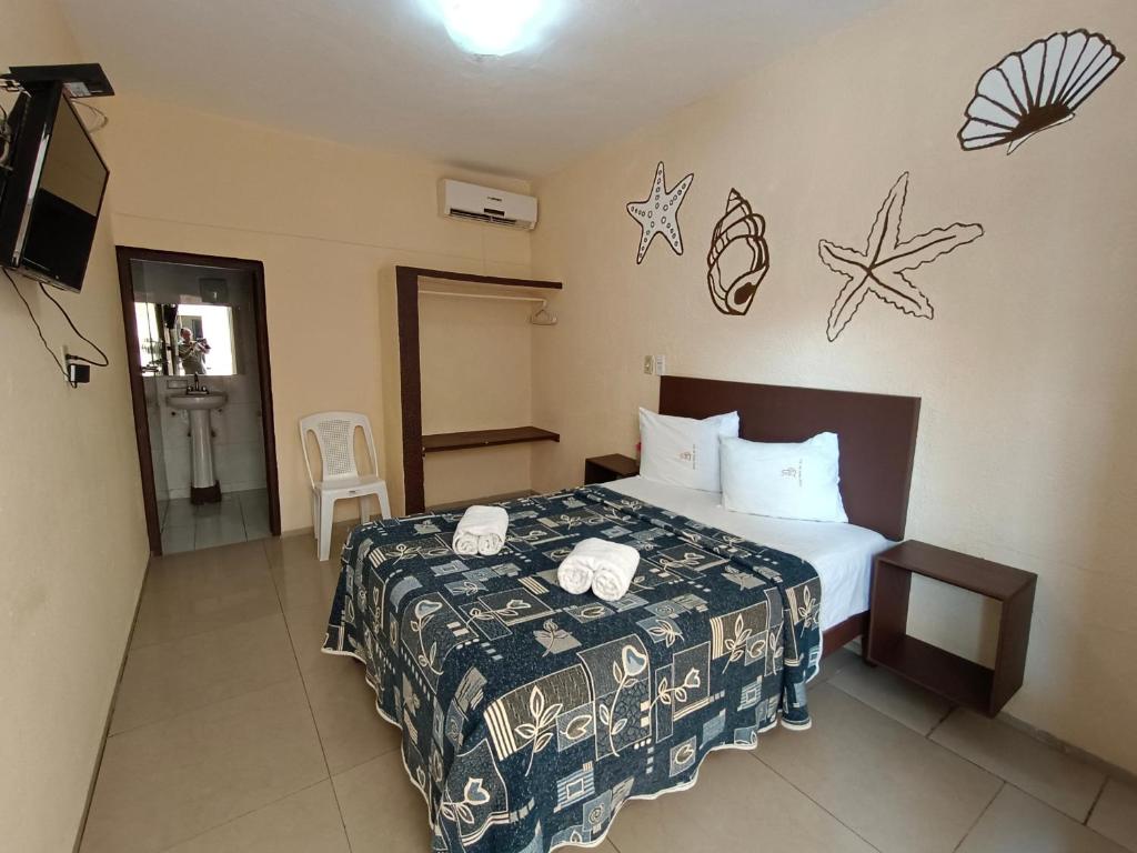 Postel nebo postele na pokoji v ubytování Hotel Playa de Oro - Enfrente de WTC y Plazas Comerciales