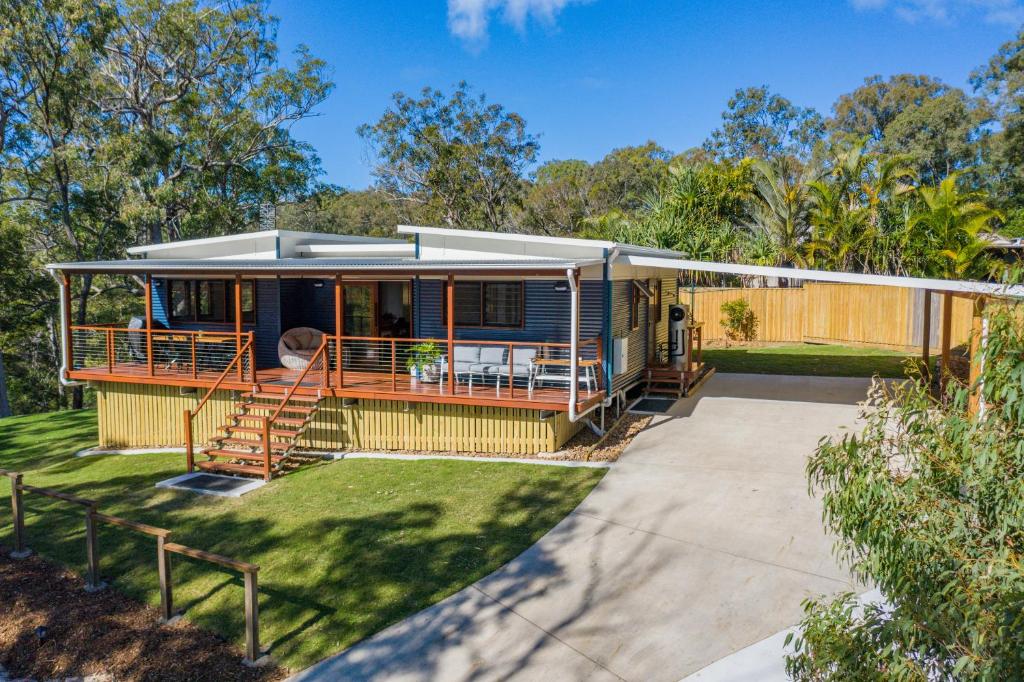 a mobile home with a porch and a patio at Little Mountain Retreat in Caloundra