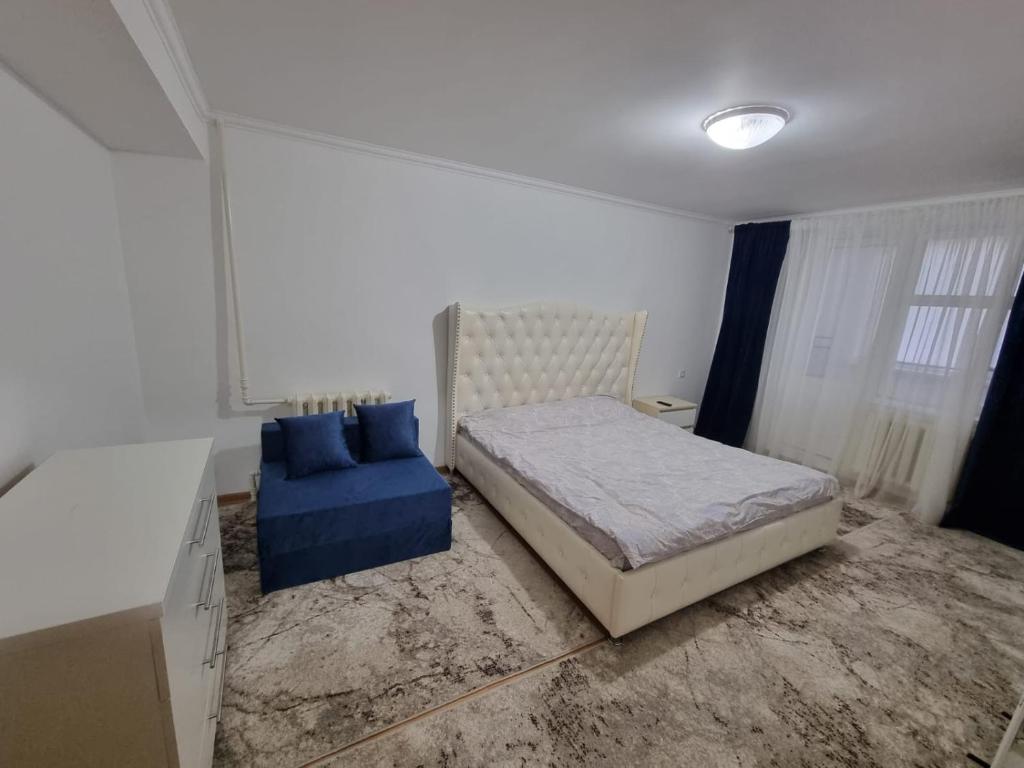 Un pat sau paturi într-o cameră la Apartament 1 camera