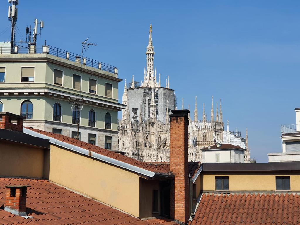 a view of theatican from roofs of buildings at View Luxury Duomo in Milan