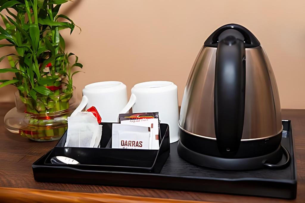 Příslušenství pro přípravu čaje a kávy v ubytování Stovehouse Inn