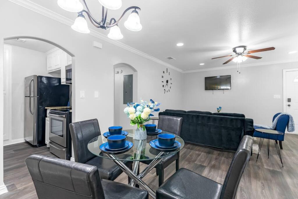 a living room with a table and a couch at Family Friendly 2bdrm-Walk To At&t/Cowboys Stadium in Arlington