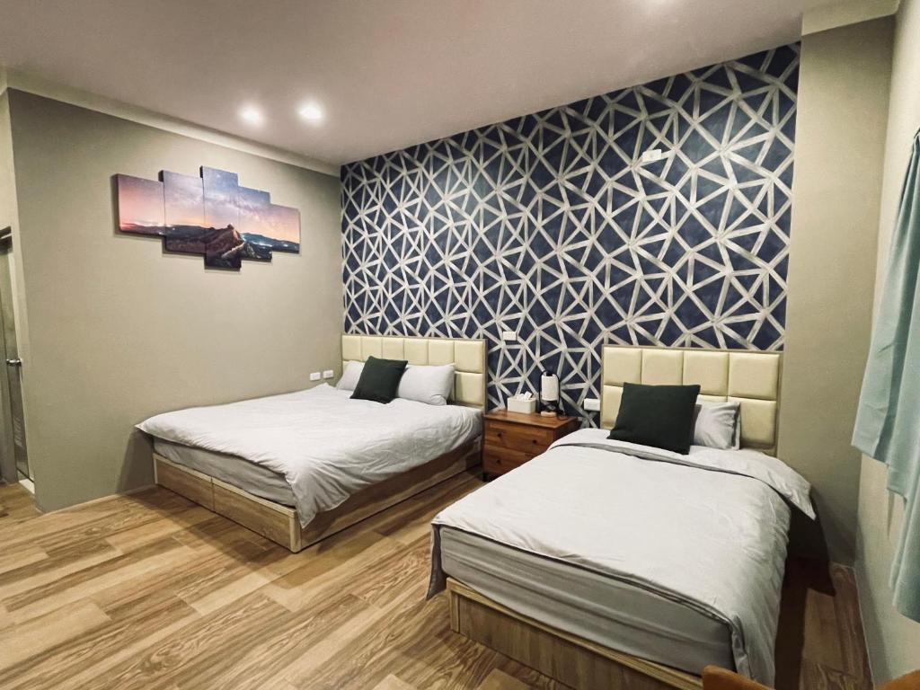 Postel nebo postele na pokoji v ubytování 鄉間小路 Home 備有專屬停車場