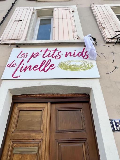a sign above a door with a sign above it at Le Repaire du p&#39;tit Chartreux by LPNL in Rives