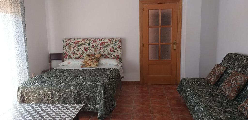 Postel nebo postele na pokoji v ubytování Los Castros