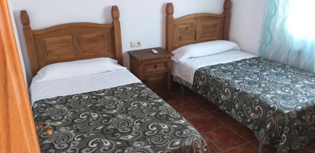 Postel nebo postele na pokoji v ubytování Los Castros