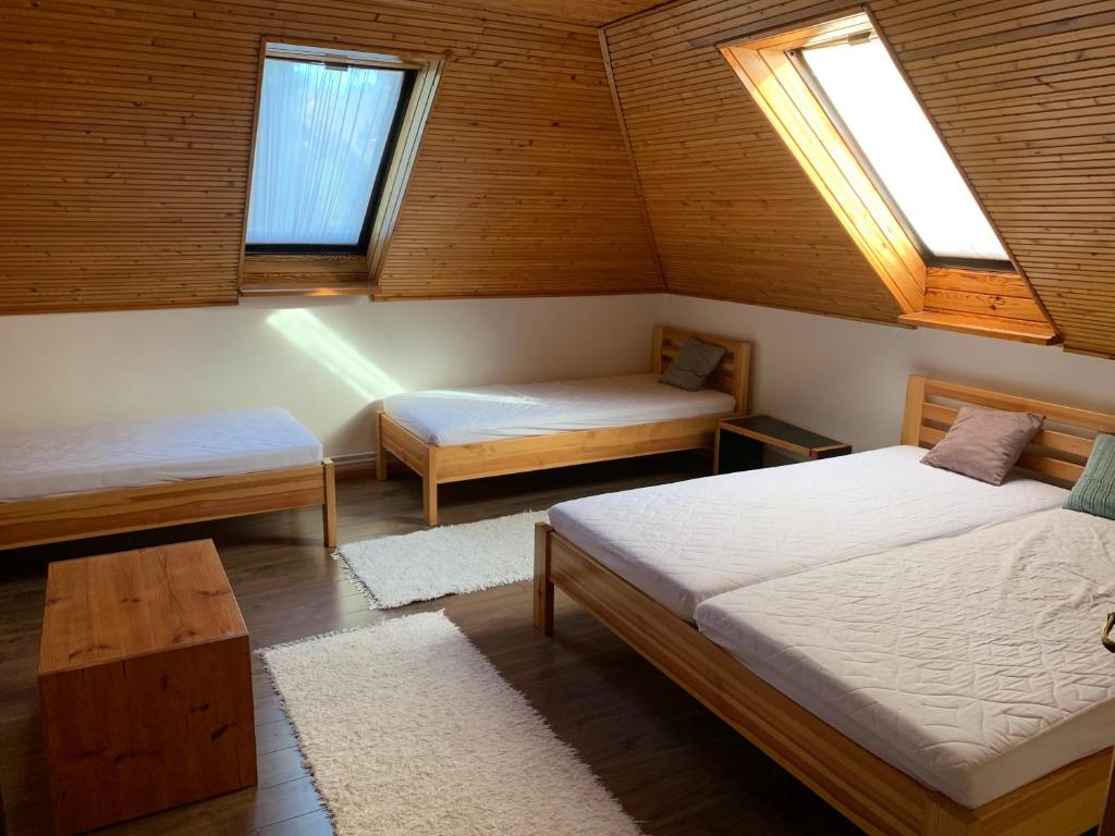 Postel nebo postele na pokoji v ubytování Bolla Nyaralóház