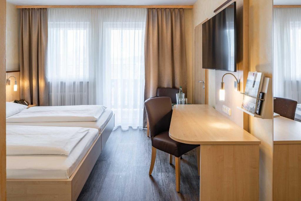 Postel nebo postele na pokoji v ubytování Hotel Wolfringmühle