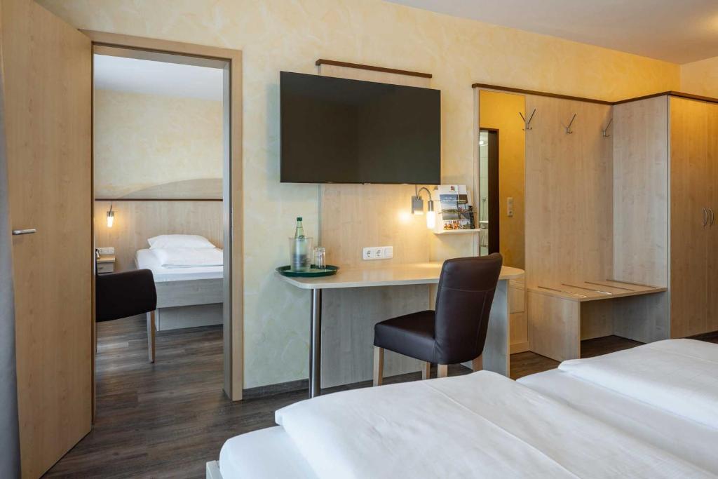 Postel nebo postele na pokoji v ubytování Hotel Wolfringmühle