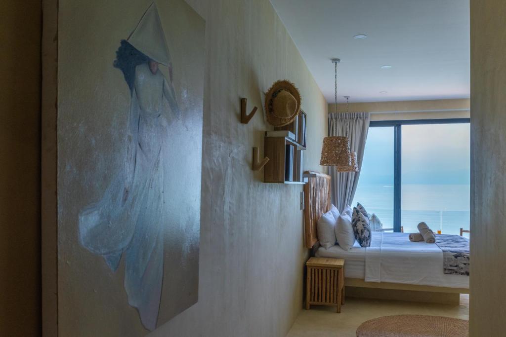 Postel nebo postele na pokoji v ubytování Riviera Beach Hotel