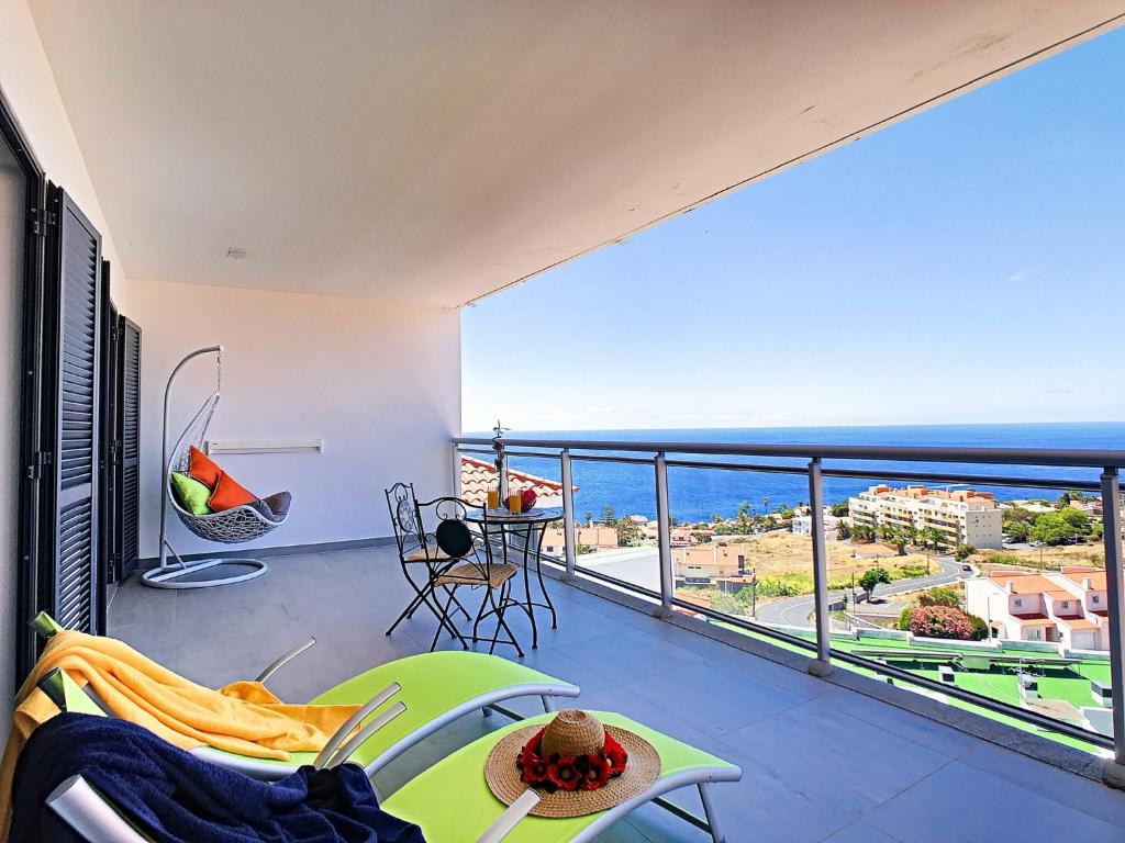 a balcony with a view of the ocean at Apartment Nata by Holiday Rental Madeira in Caniço