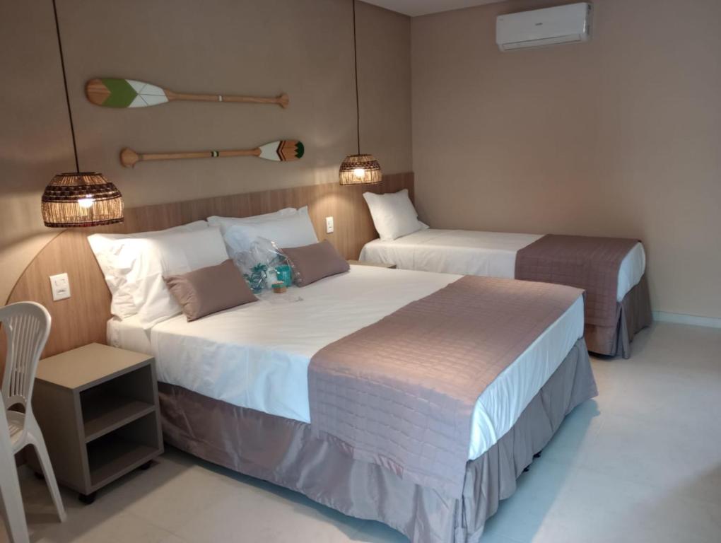 Кровать или кровати в номере Hotel Coco Beach
