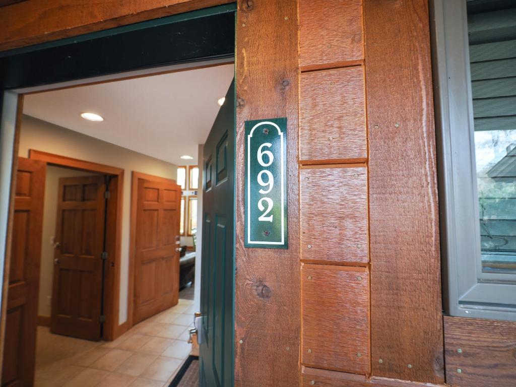 a sign on the door of a house at 692 Disciples Village Condo in Boyne Falls