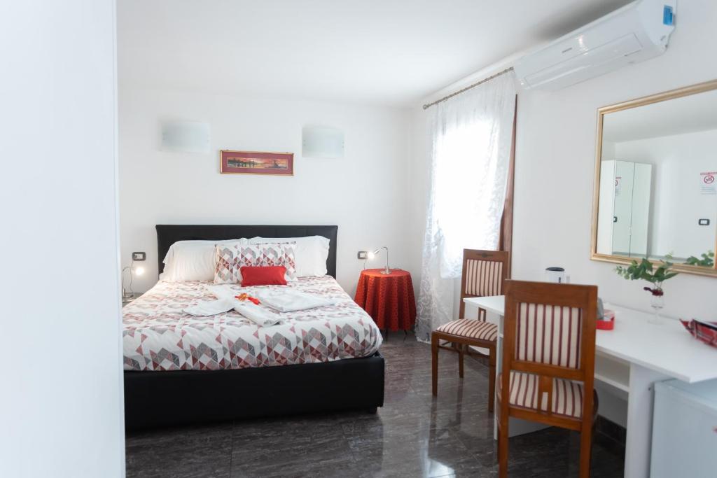 Posteľ alebo postele v izbe v ubytovaní B&B Antico Orologio