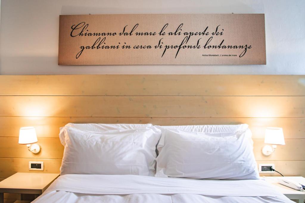 Postel nebo postele na pokoji v ubytování Hotel Universal