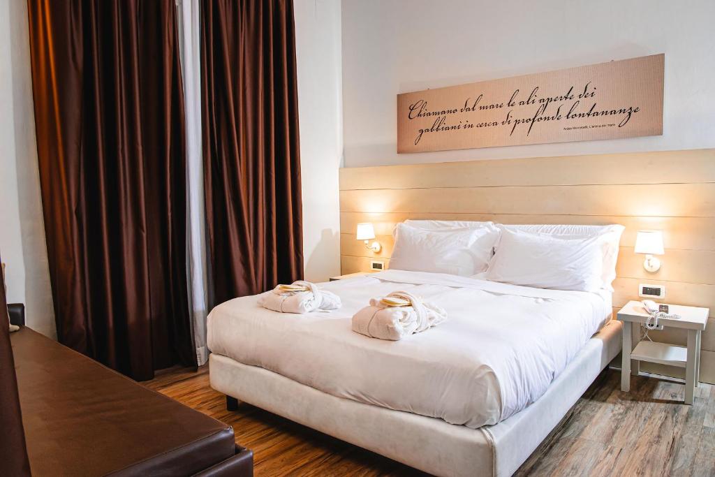 Postel nebo postele na pokoji v ubytování Hotel Universal