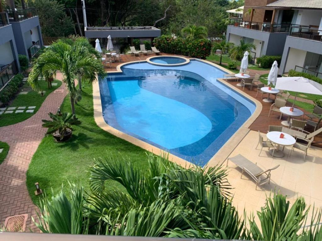 an image of a swimming pool in a yard at Imbassaí Bahia Temporada Térreo in Imbassai