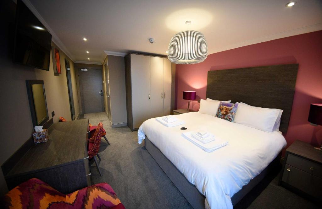 Postel nebo postele na pokoji v ubytování Taransay House, Small Hotel