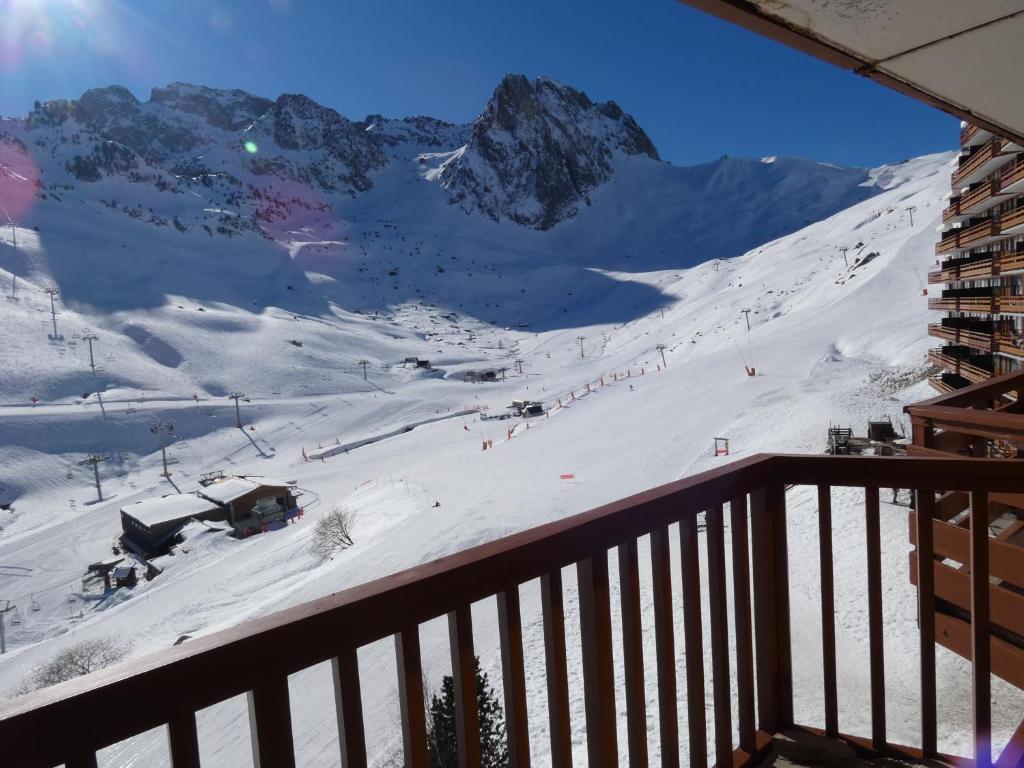 a view of a snow covered mountain from a balcony at Appartements pied des pistes - Résidence Mongie - Tourmalet in La Mongie