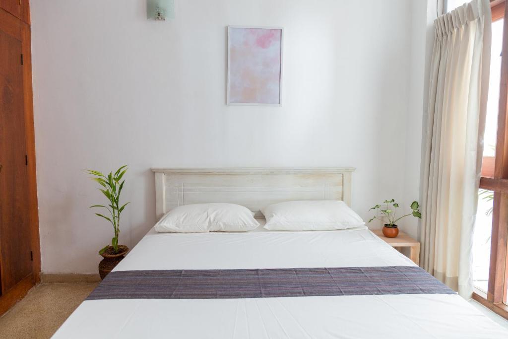 Postel nebo postele na pokoji v ubytování Greenscape Colombo