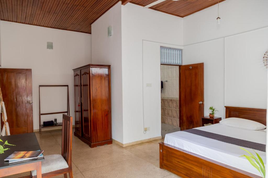 Postel nebo postele na pokoji v ubytování Greenscape Colombo