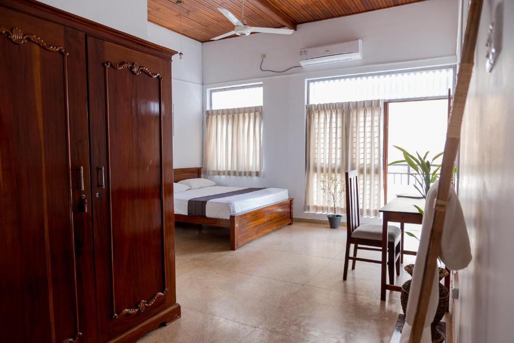 Postel nebo postele na pokoji v ubytování Greenscape Colombo
