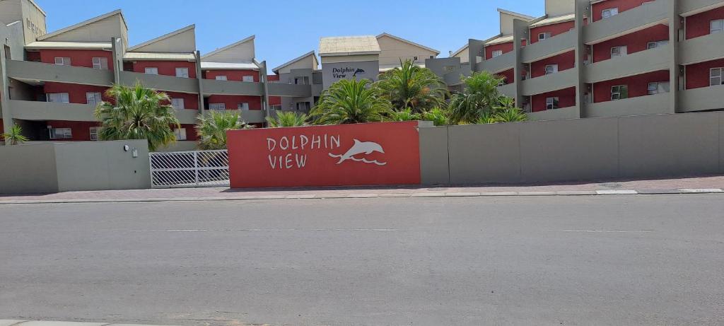 a sign on the side of a street in front of a building at Beach Hive 2 in Walvis Bay