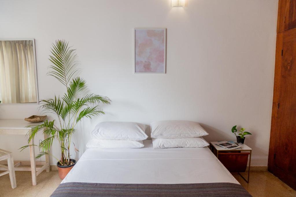 Postel nebo postele na pokoji v ubytování Greenscape Colombo