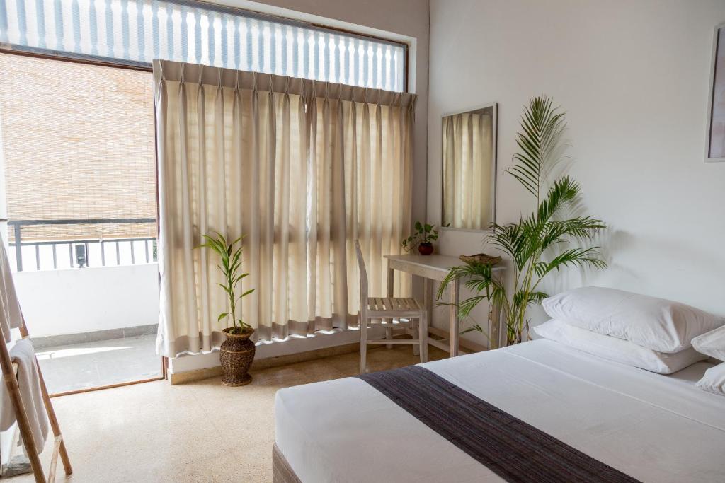 Postel nebo postele na pokoji v ubytování Greenscape Colombo