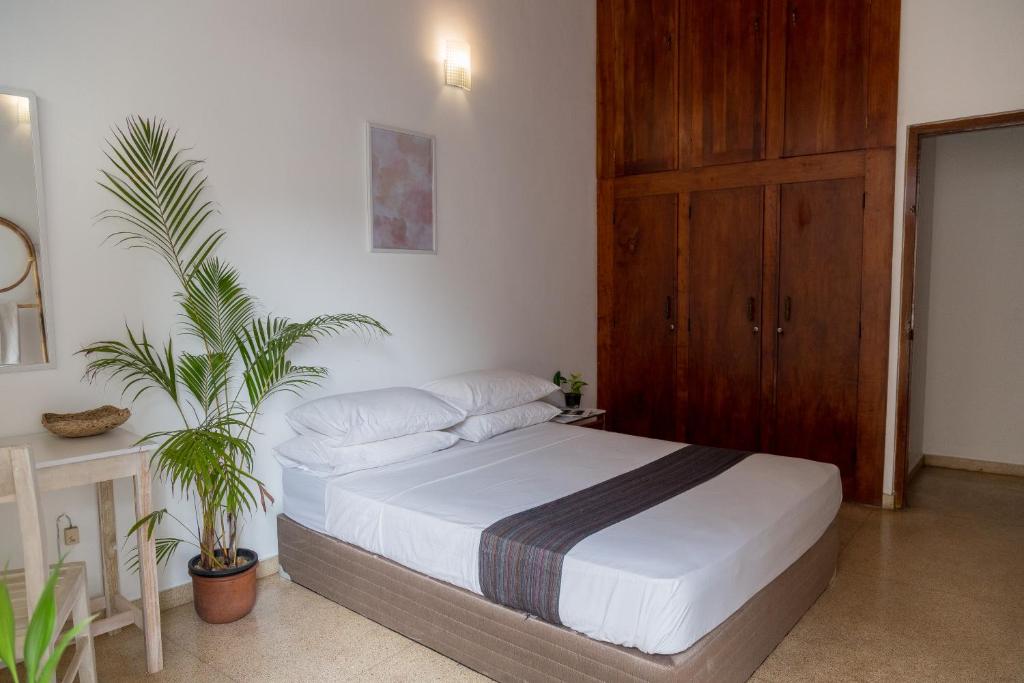 Postel nebo postele na pokoji v ubytování Greenscape Colombo