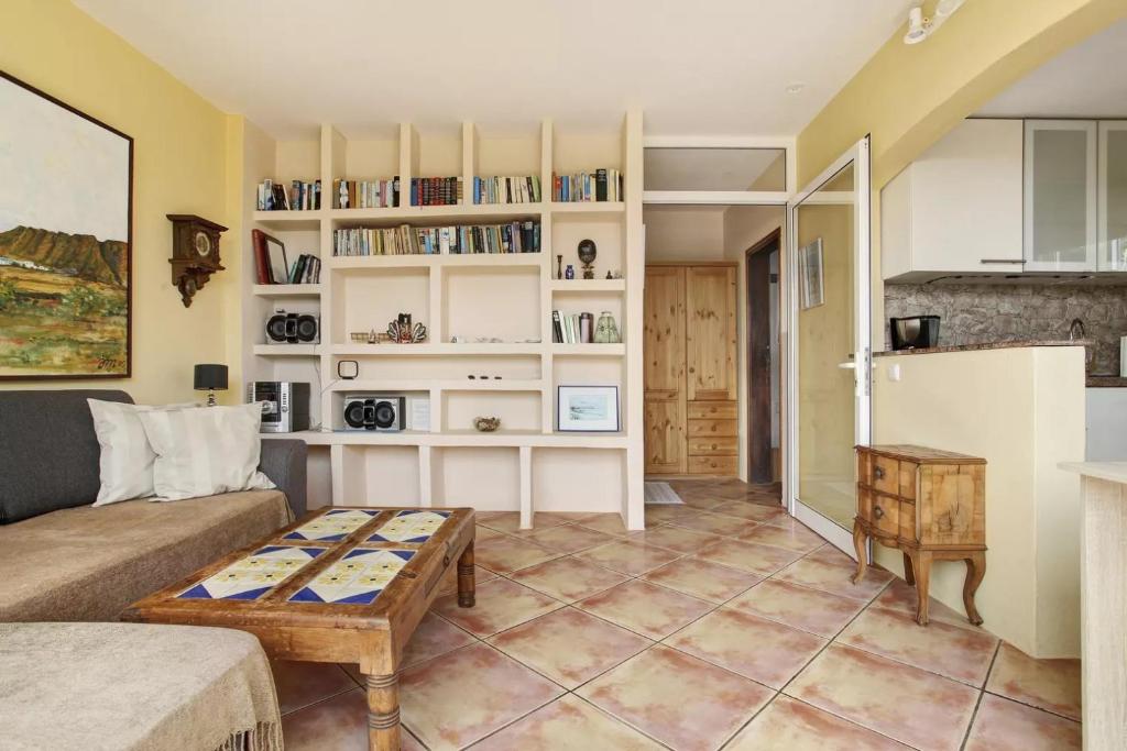 a living room with a couch and a table at Casa Verde in Teguise