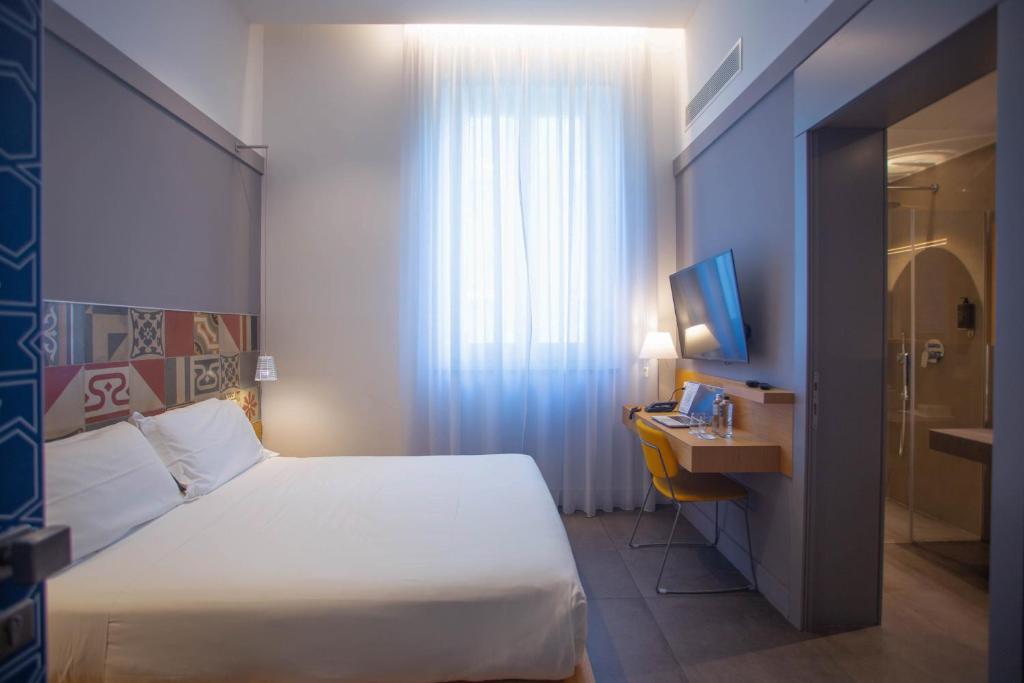 Postel nebo postele na pokoji v ubytování Hotel Medinblu