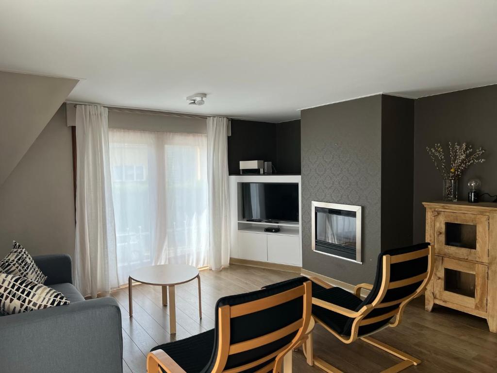 a living room with a couch and a table at Appartement29 in Wetteren