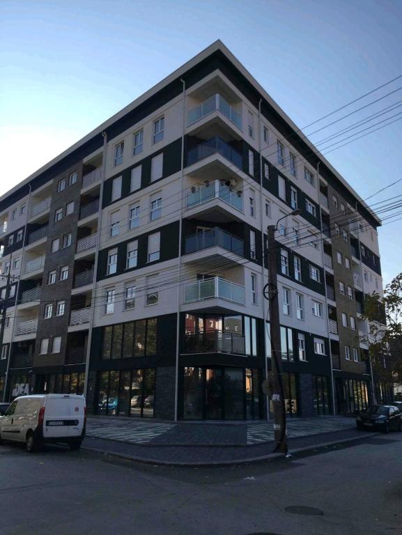 a large building on the corner of a street at Twins Apartments in Čačak