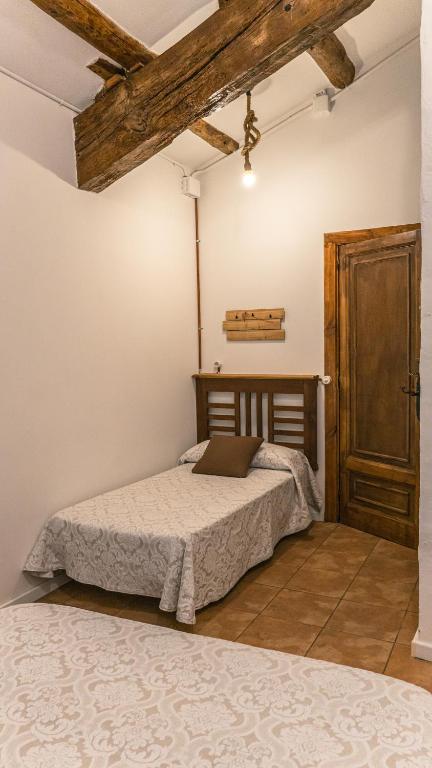 Posteľ alebo postele v izbe v ubytovaní Cal Belló Casa rural