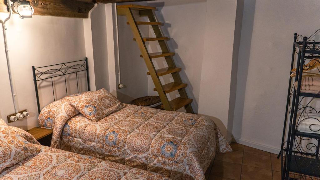 Posteľ alebo postele v izbe v ubytovaní Cal Belló Casa rural
