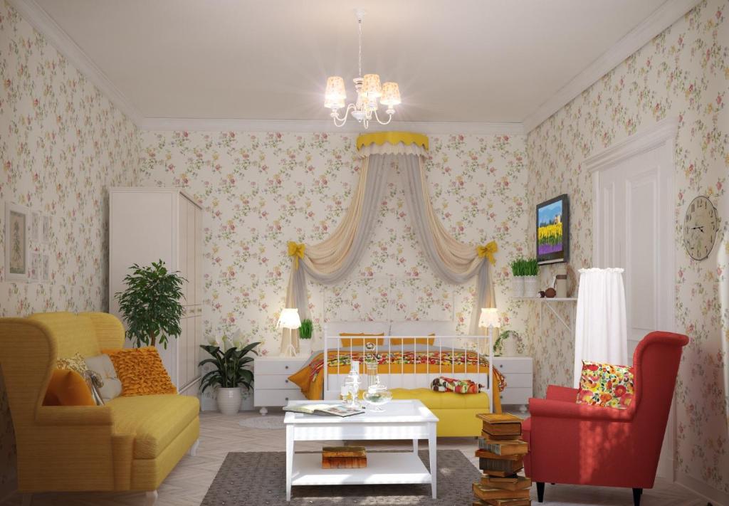 リヴィウにあるEdem Apartmants in Lviv 2のリビングルーム(ベッド1台、ソファ、テーブル付)